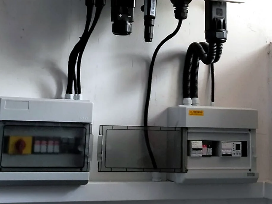 DC isolator and AC protection boxes connected to a GOODWE inverter