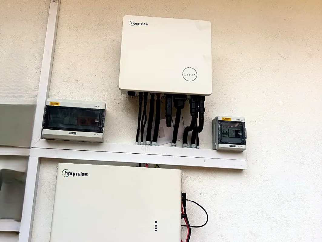 Hoymiles hybrid inverter and battery installed with protection boxes